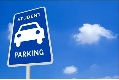 blue sign that says student parking