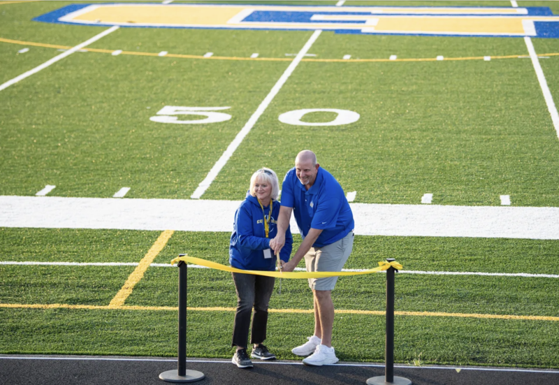 Dandy Stevens and Doug Loiler cutting the celebratory ribbon