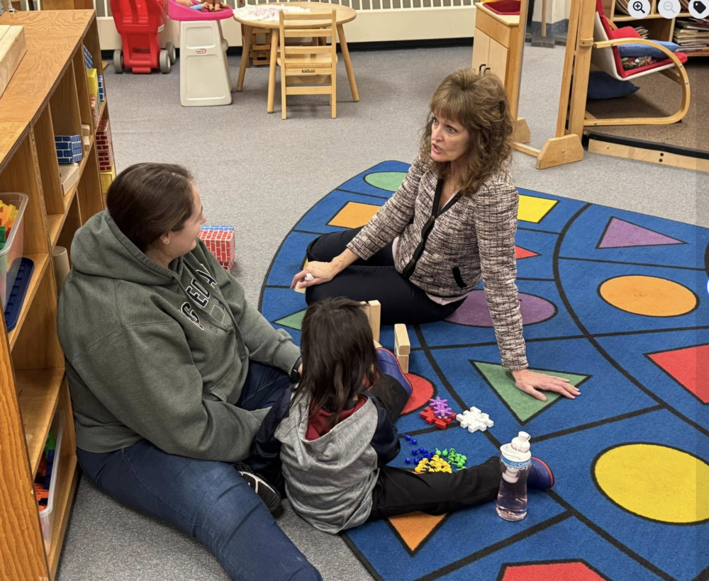 Parent educator working with family and student