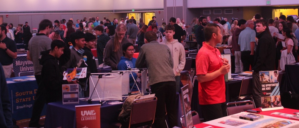 the minnesota education fair with tables and students