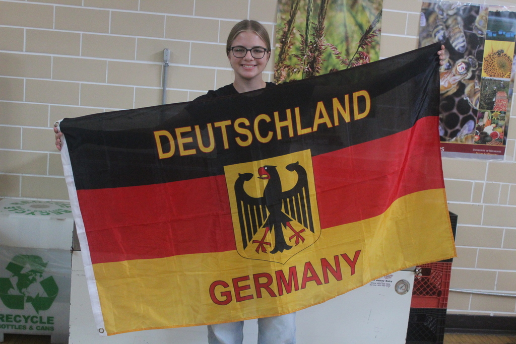student holding german flag