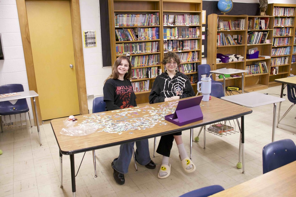 students putting together a puzzle
