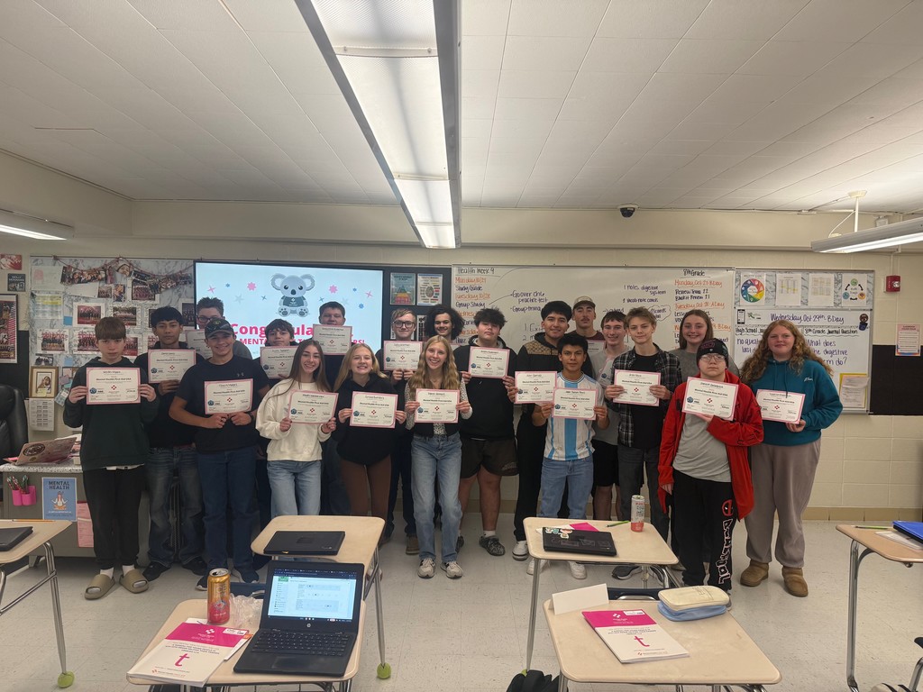 Students holding certificates