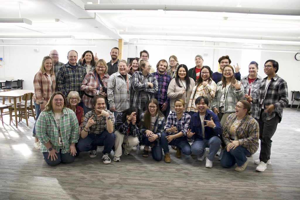 Staff in flannel laughing
