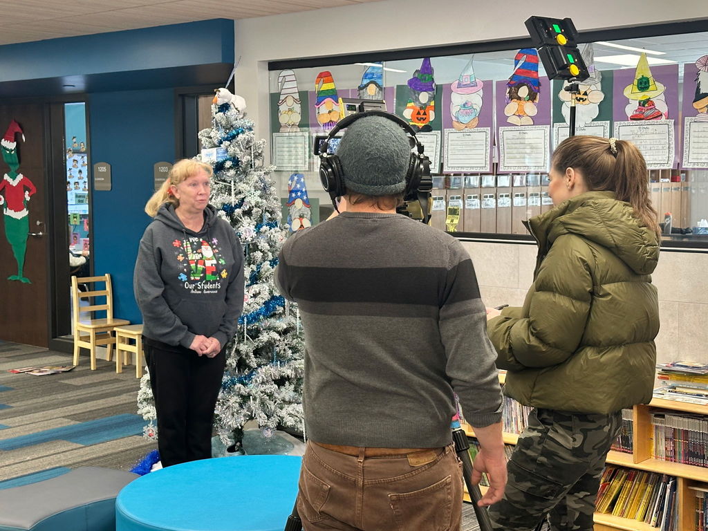 teacher talking to news crew