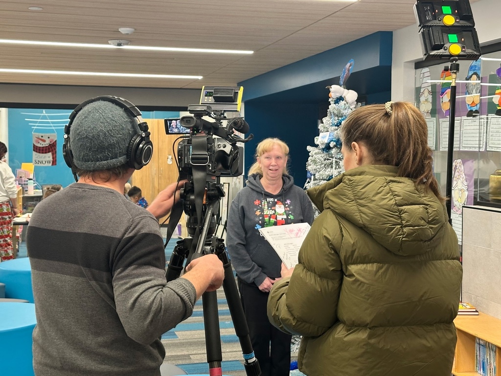 teacher talking to news crew