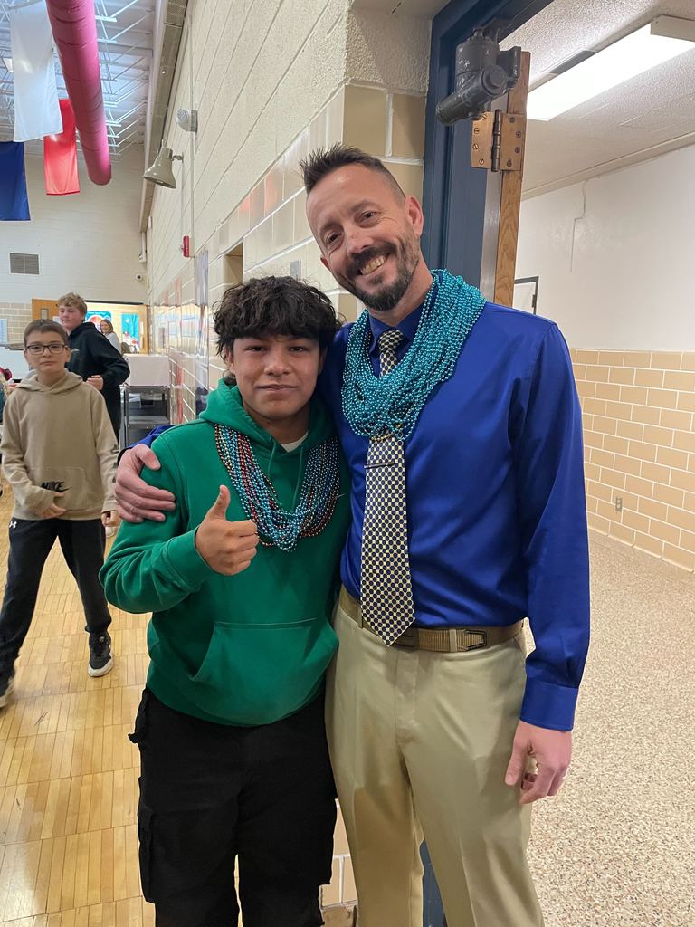 Student and staff member wearing bead necklaces