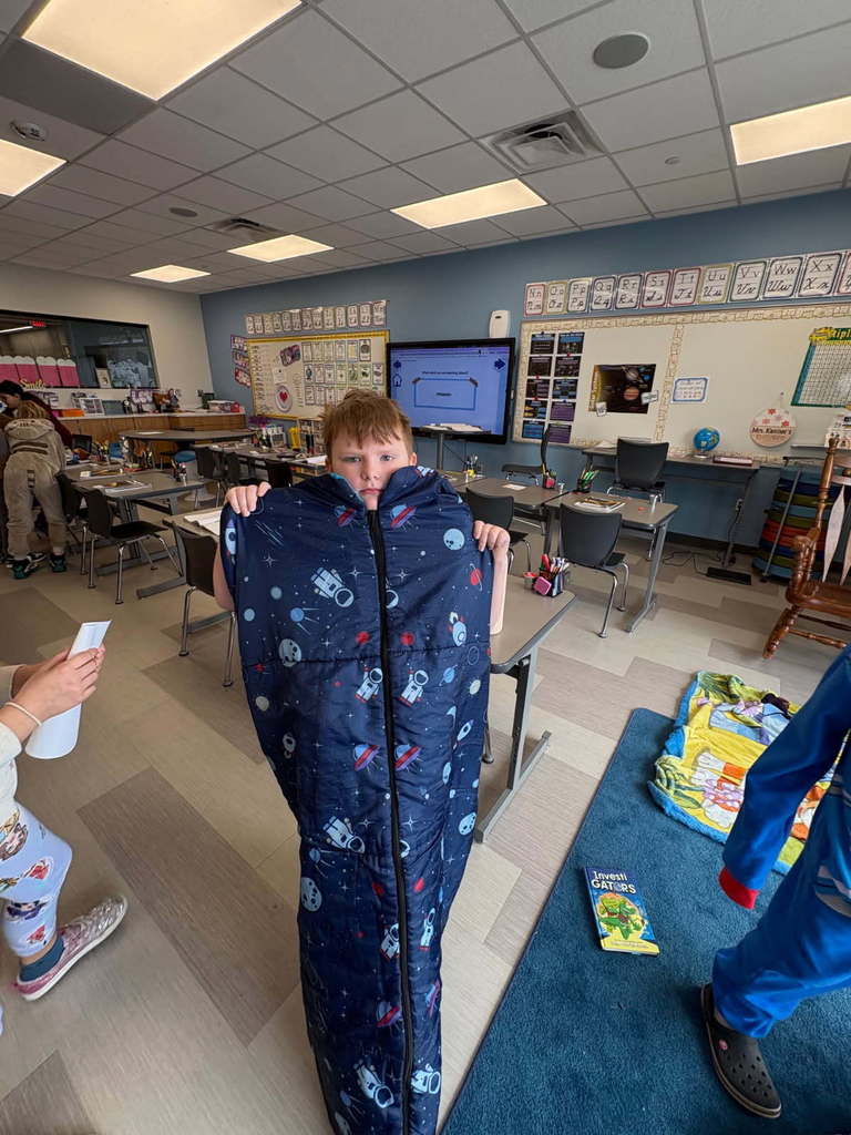 student with sleeping bag