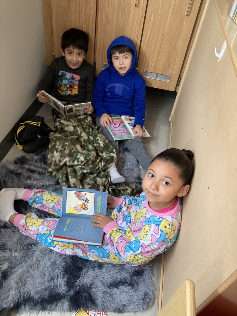 Students reading with blankets