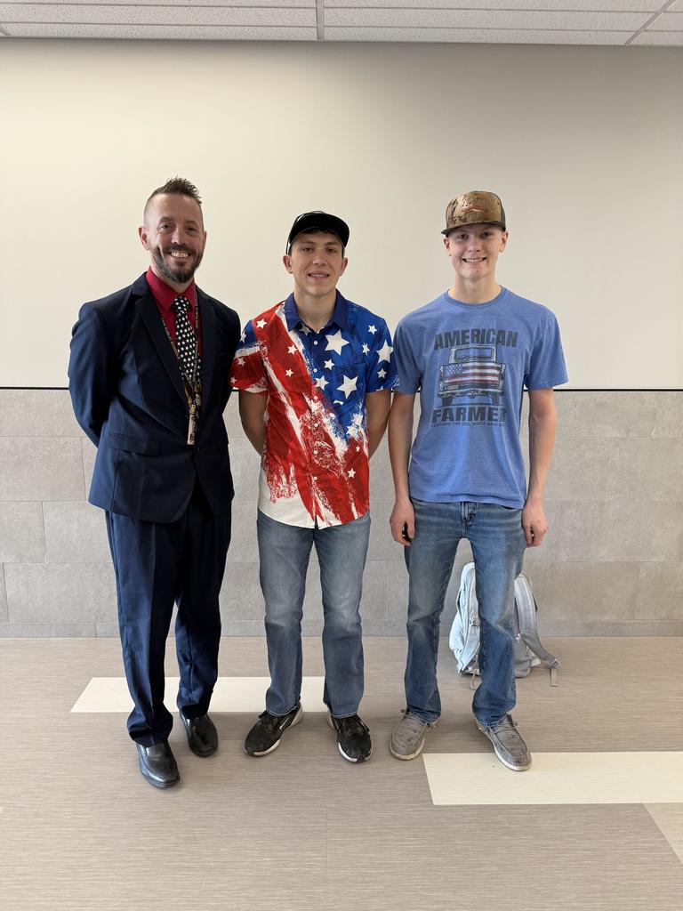 staff and students wearing red white and blue