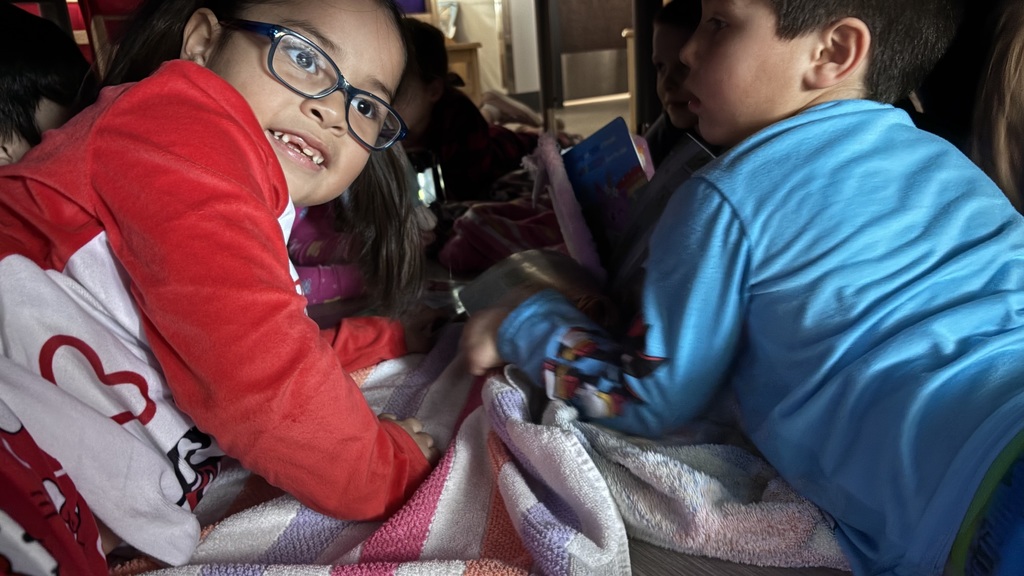 kids reading in a fort