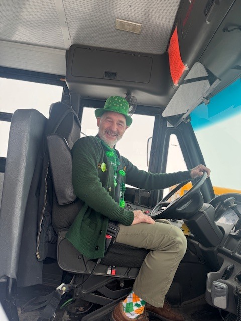 Bus driver wearing green