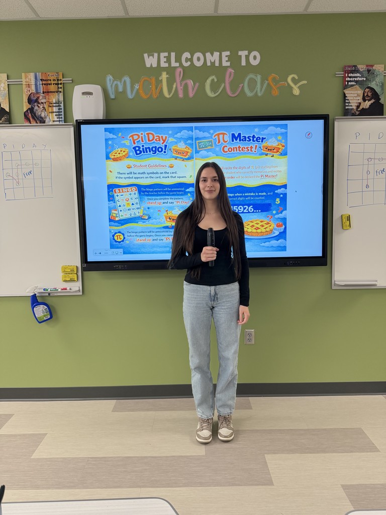Student in front of class with microphone