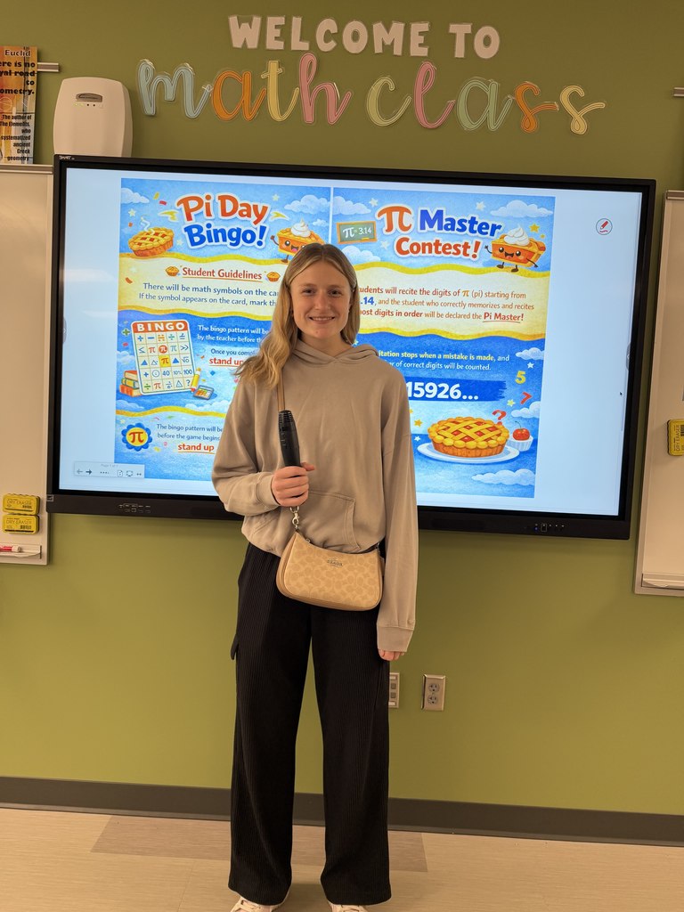 Student in front of class with microphone
