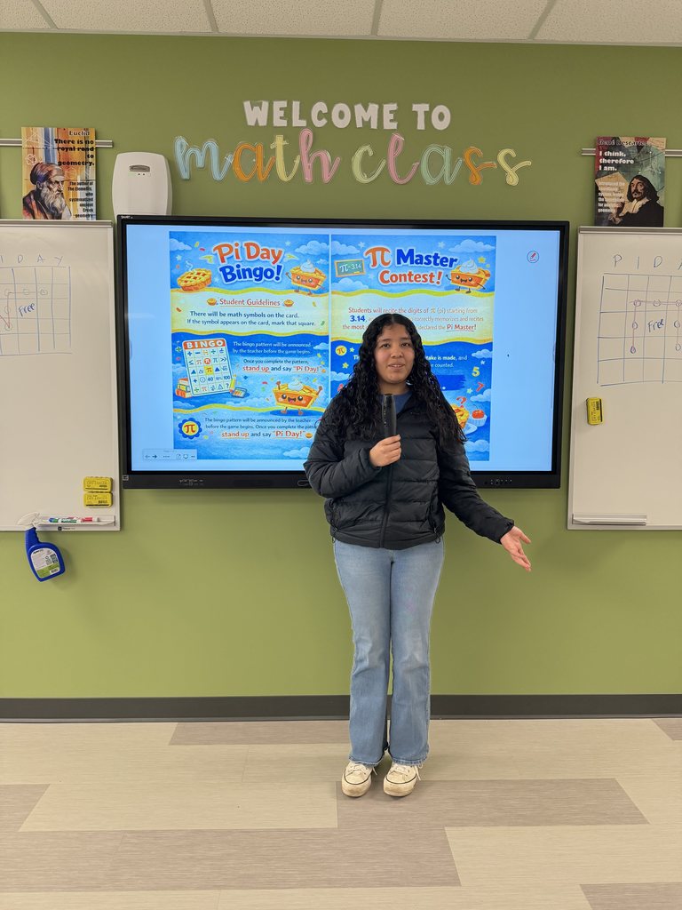 Student in front of class with microphone