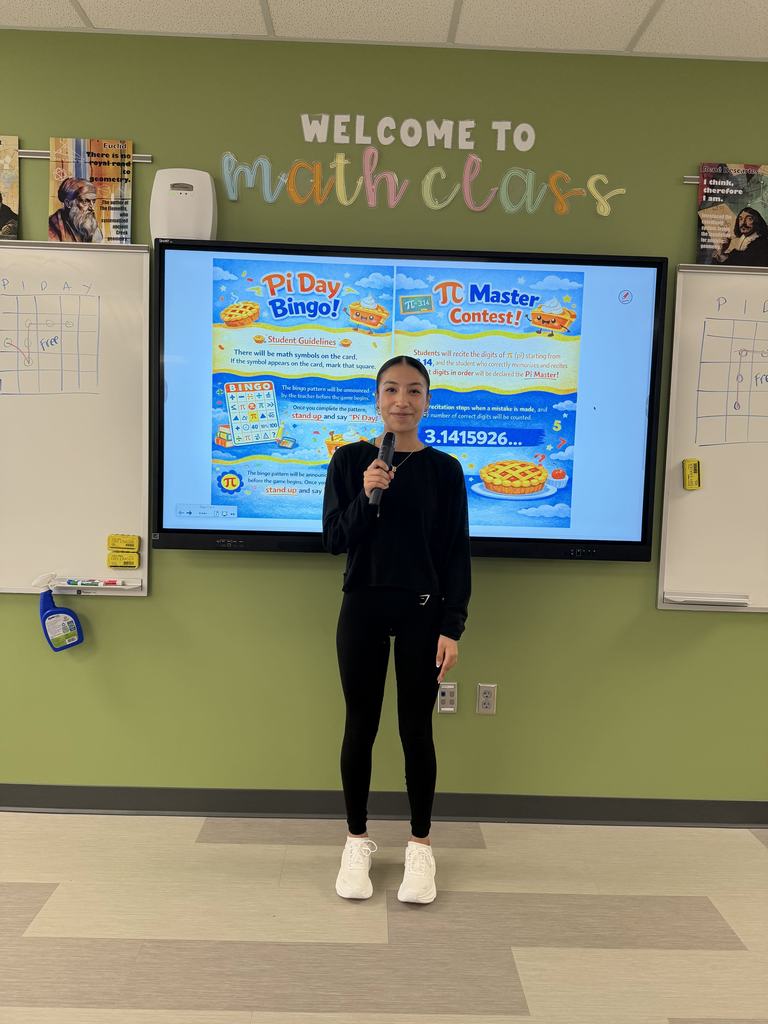 Student in front of class with microphone