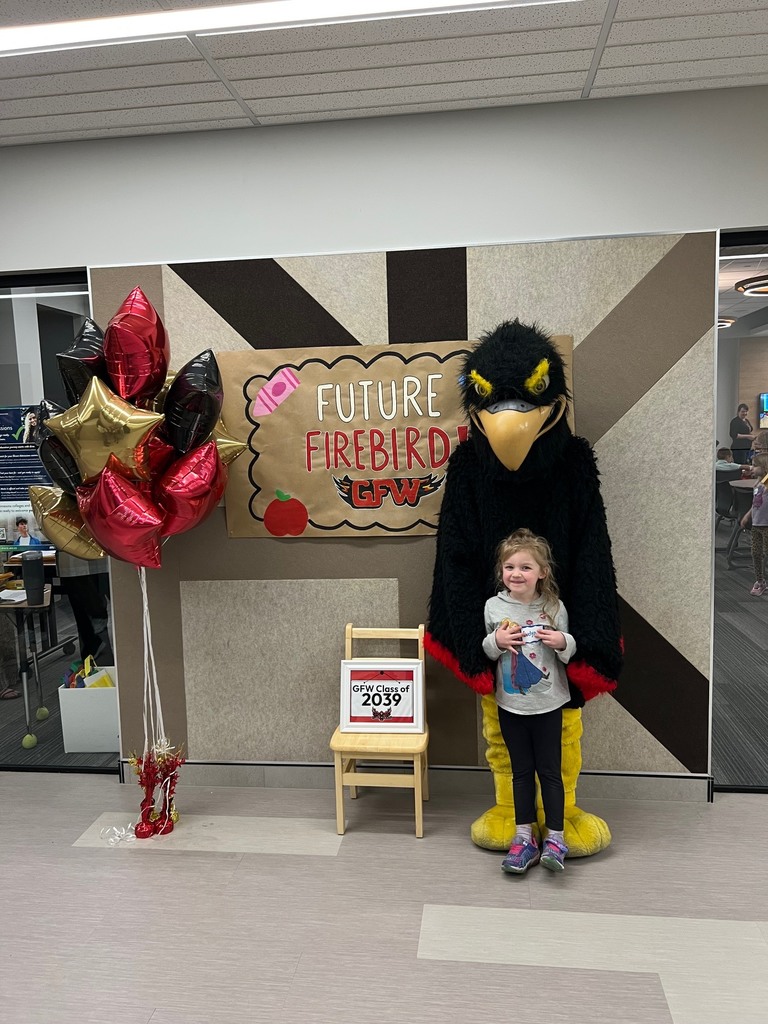 Future firebird pose with student and mascot