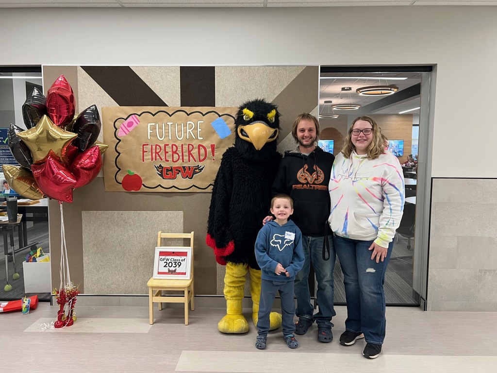 Future firebird pose with student and mascot