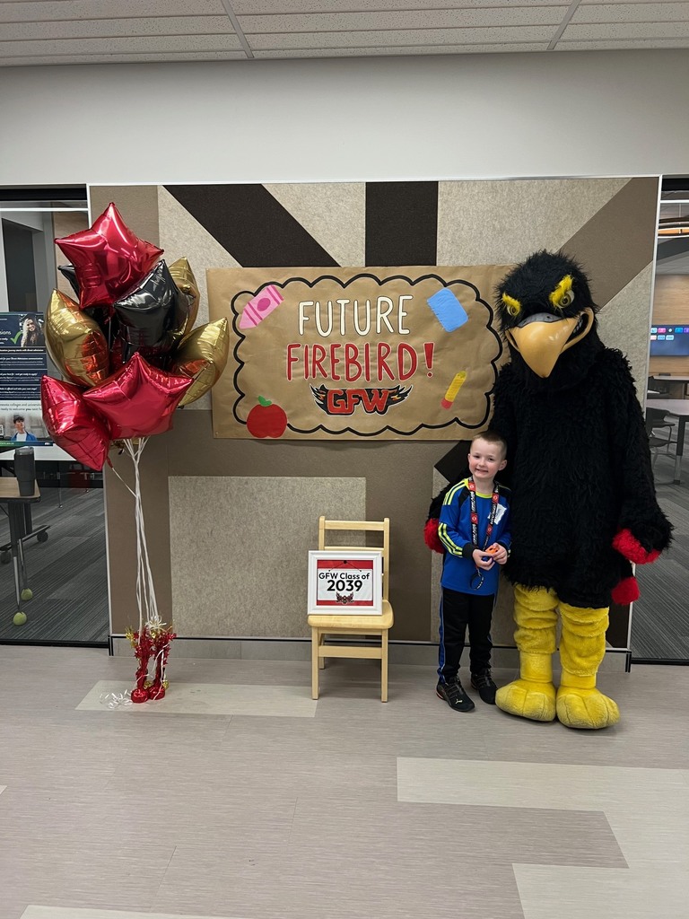 Future firebird pose with student and mascot