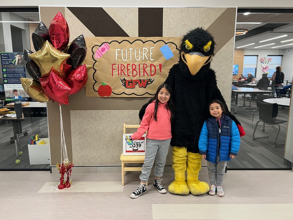 Future firebird pose with student and mascot