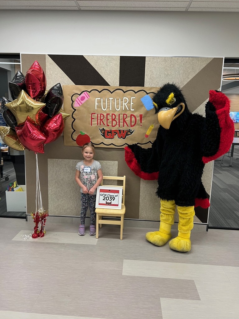 Future firebird pose with student and mascot