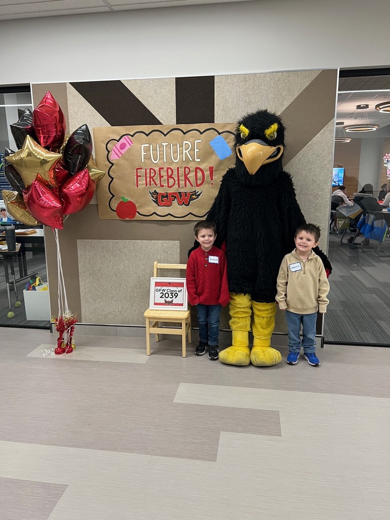 Future firebird pose with student and mascot