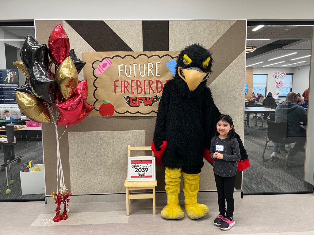 Future firebird pose with student and mascot