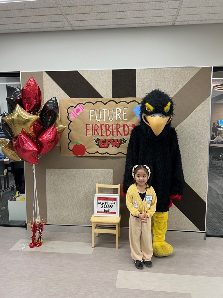 Future firebird pose with student and mascot