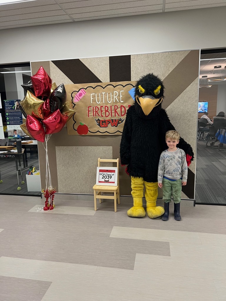 Future firebird pose with student and mascot