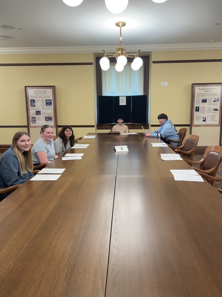 Students at a board table