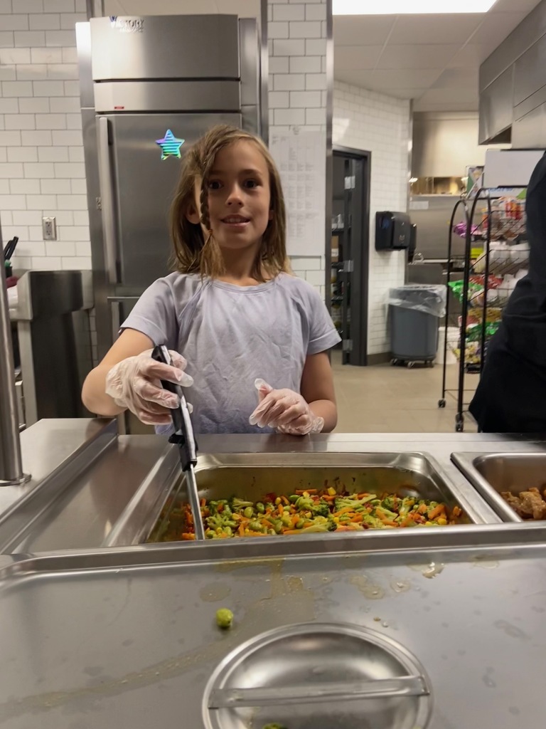 Student helper in kitchen