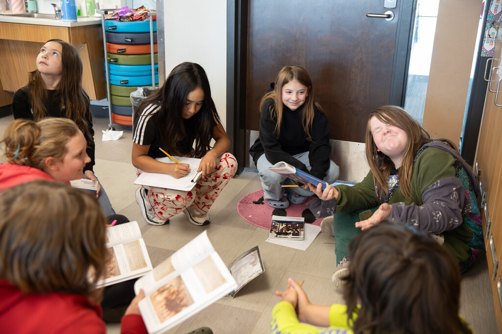 Students working together on the floor