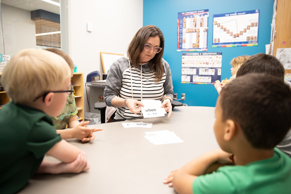 Students doing group work with teacher