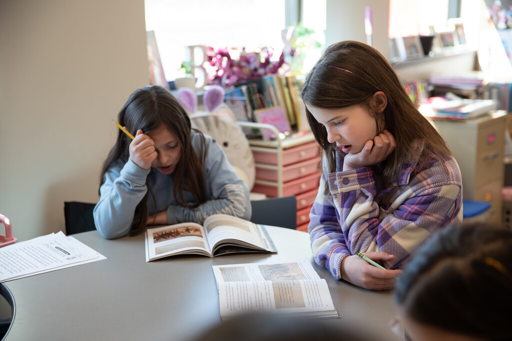 students with books in class