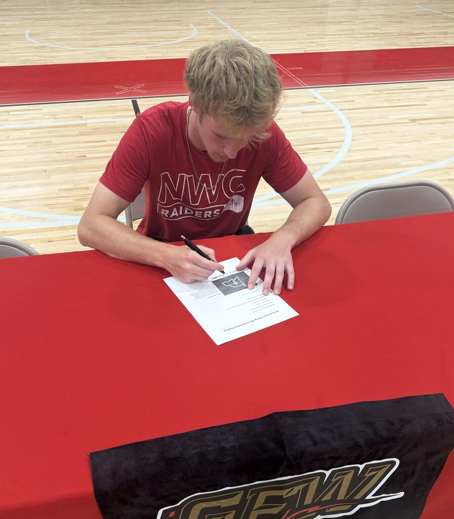 Student signing letter
