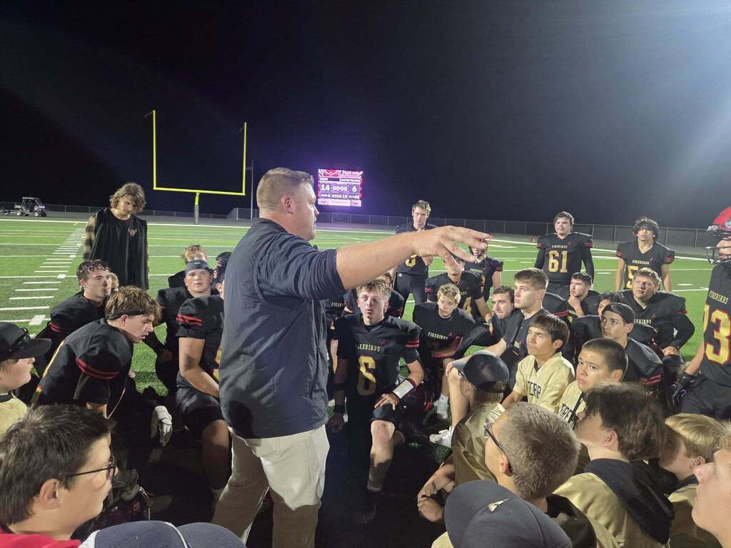 Coach Vorwerk talks to the Firebirds after Friday night's win.