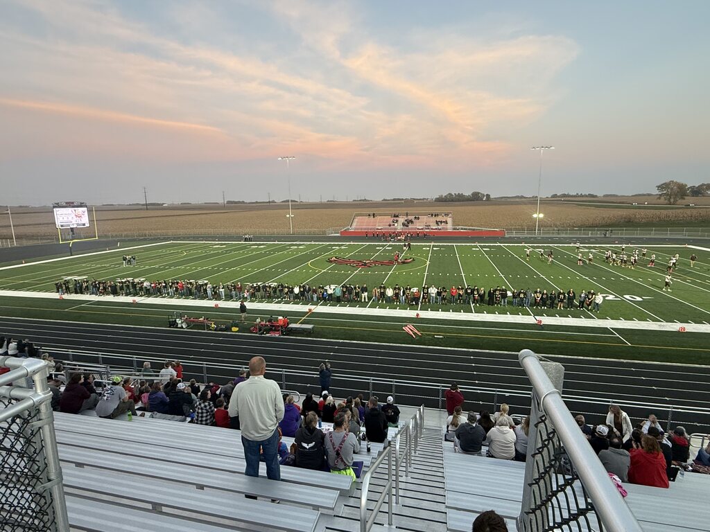 The Firebirds and their parents line the sideline ahead of Friday night's win.
