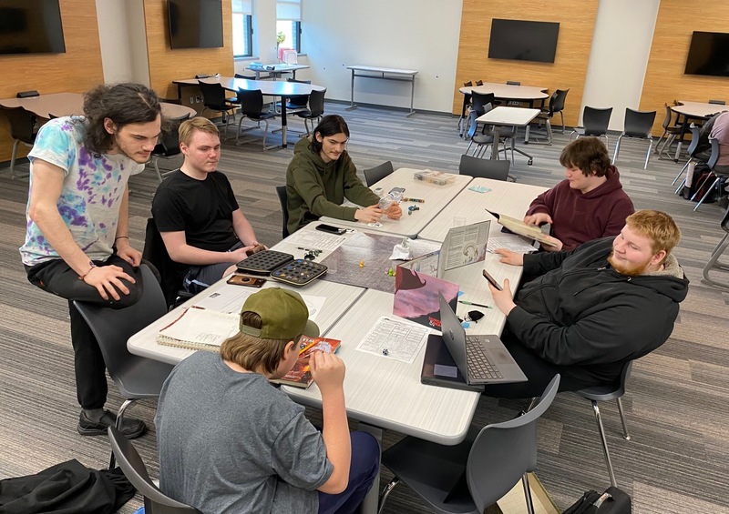 Students playing dungeons and dragons