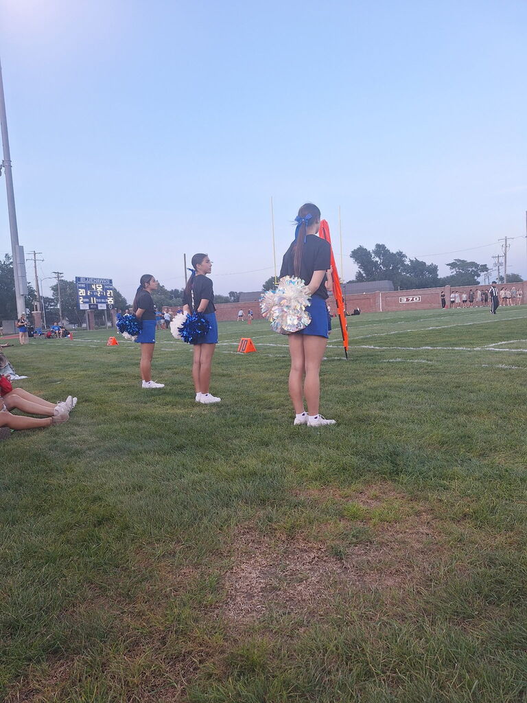 Cheerleaders at football game 