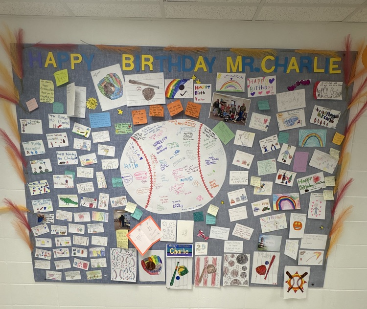 bulletin board filled with happy birthday cards