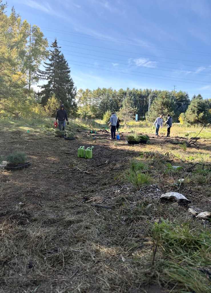 The Ecology Club planting trees at Crossroads