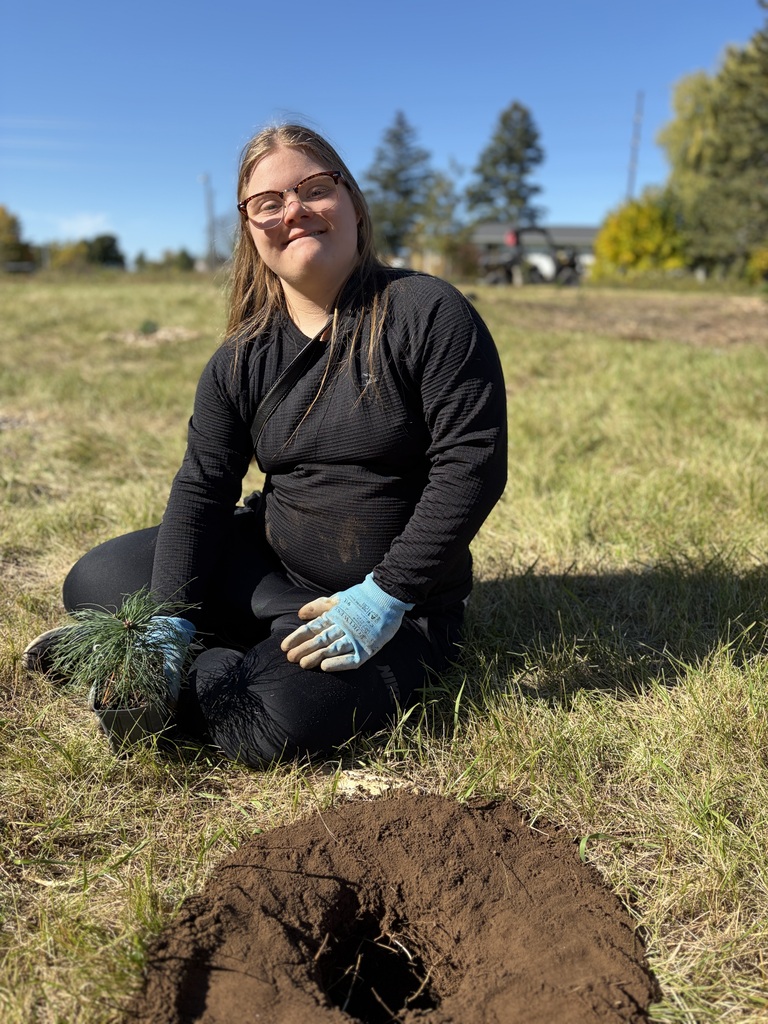 The Ecology Club planting trees at Crossroads