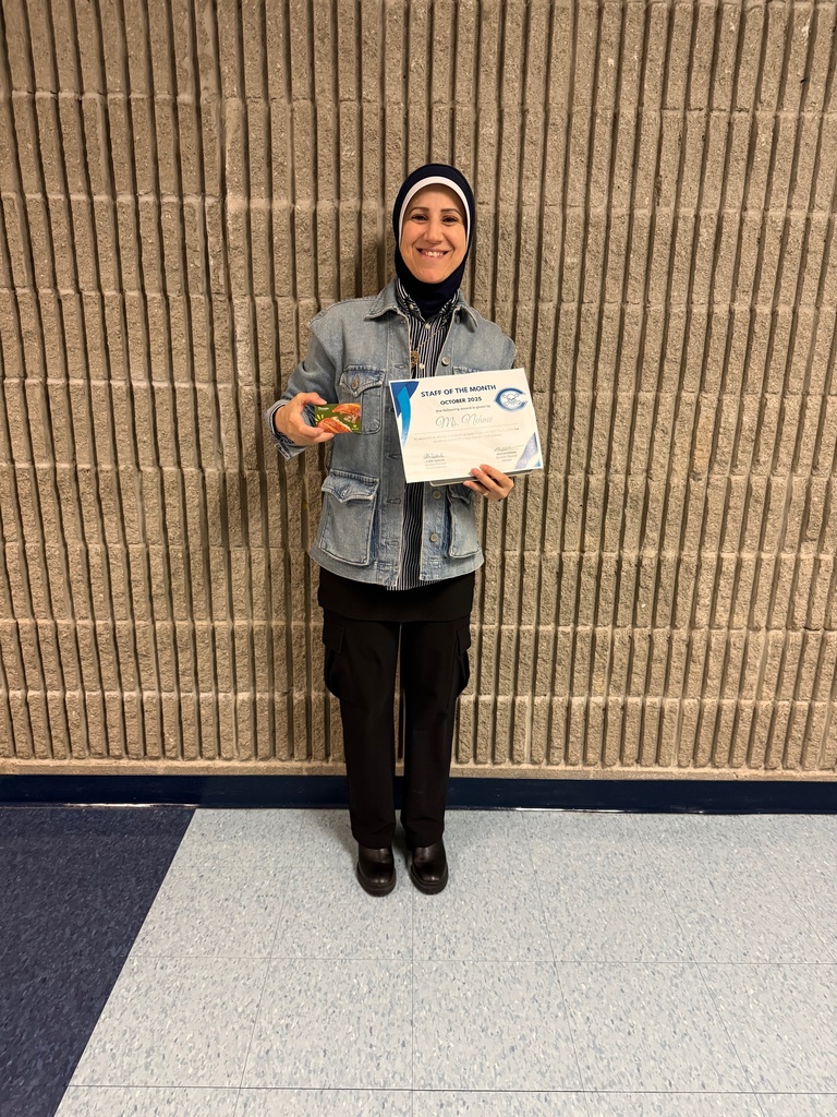 Photo of Ms. Nehme with award