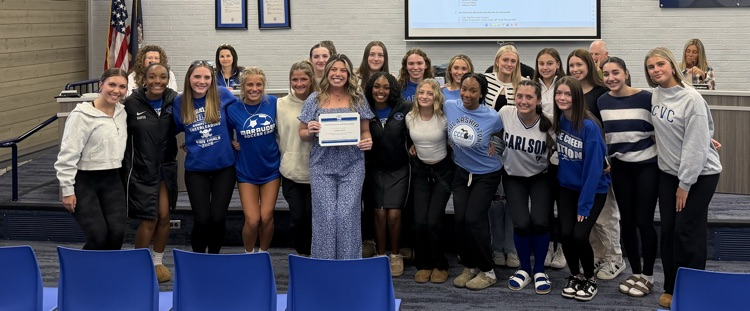 carlson cheer team with coach and her award