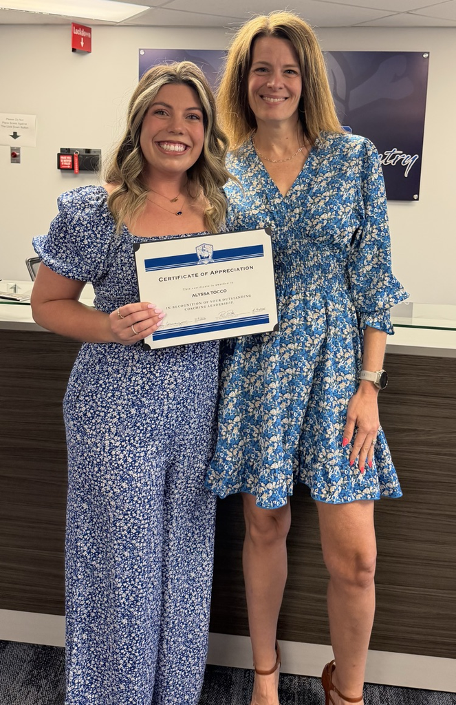 Coach and high school principal with award