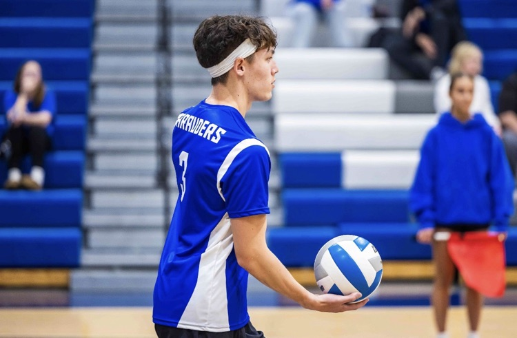 CHS Boys Club Volleyball team, player ready to serve
