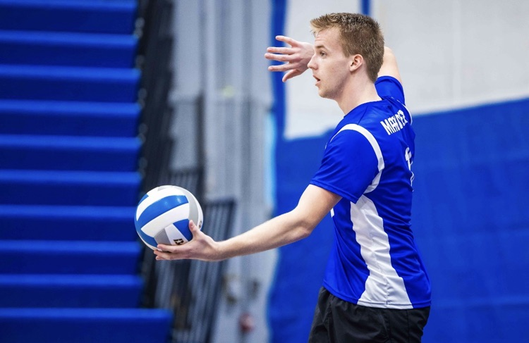 CHS Boys Club Volleyball team. Player about to serve