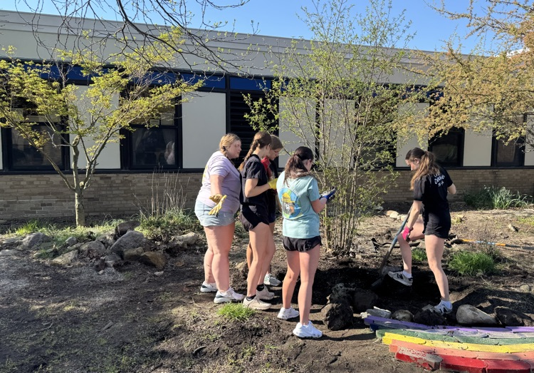CHS Earth Club students getting ready to spread mulch