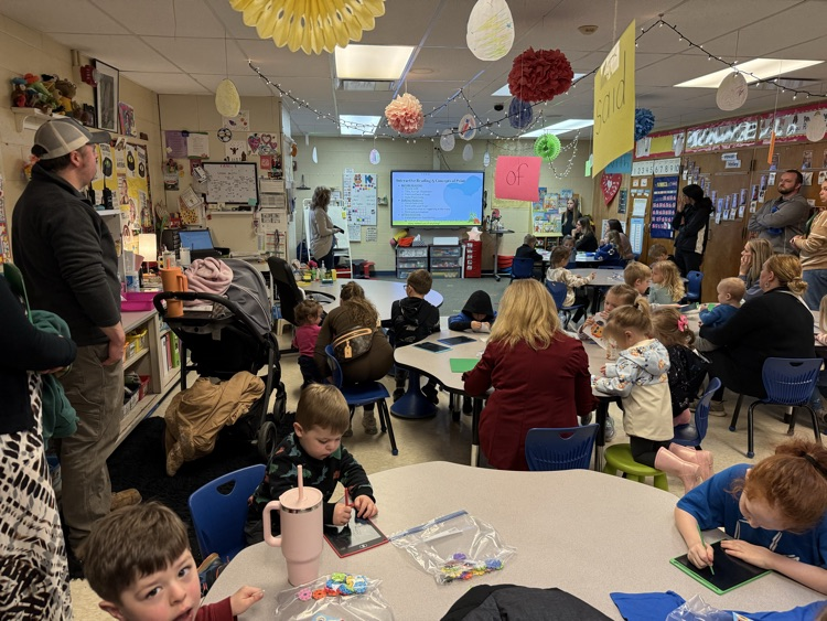 several kindergarten students working on a Craft