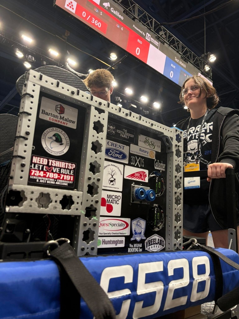 Two students working on the 6528 Robot